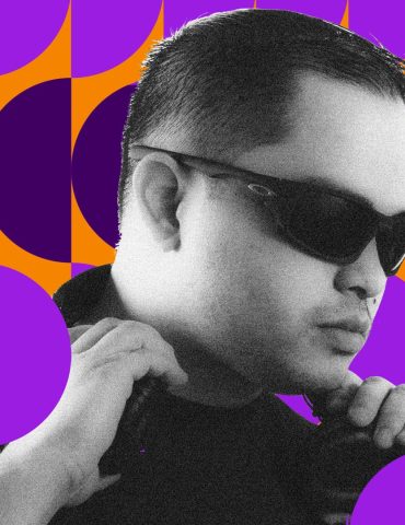 Avery Usita wearing sunglasses while DJing