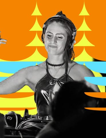 Madlon DJing while smiling and looking down at the decks