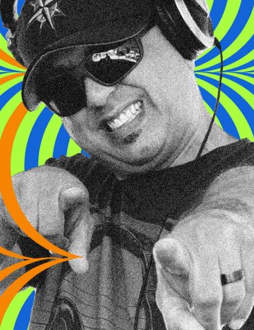 DJ Woodrow Low smiles and points at camera